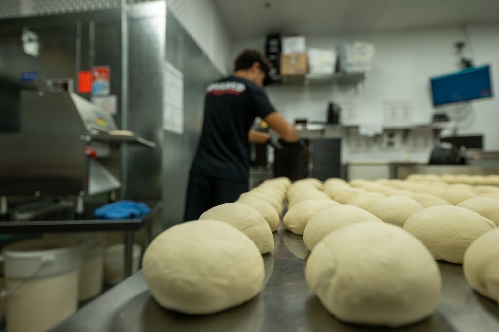 Fresh dough balls proofing at Detroit Pizza Co.