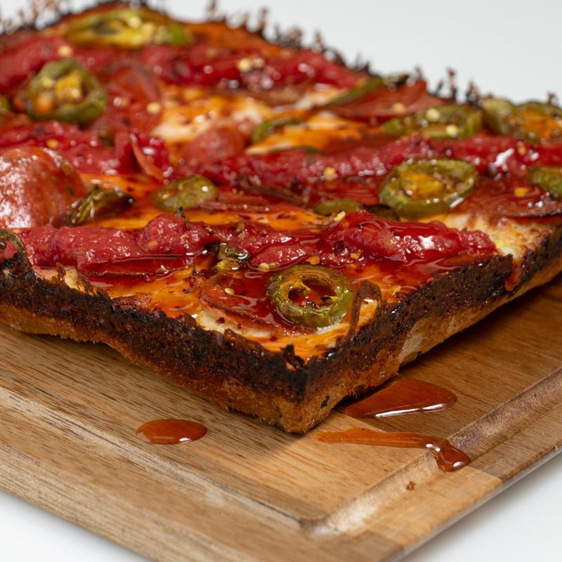 8 Mile Heat spicy Detroit-style pizza with jalapeños and hot honey