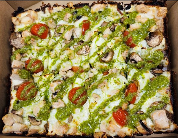 Pontiac Pesto Detroit-style pizza with grilled chicken, grape tomatoes, feta and pesto drizzle at Detroit Pizza Co. Murrieta
